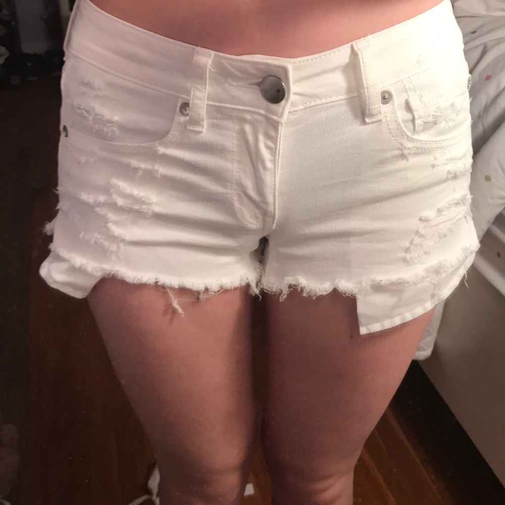 White ripped denim shorts